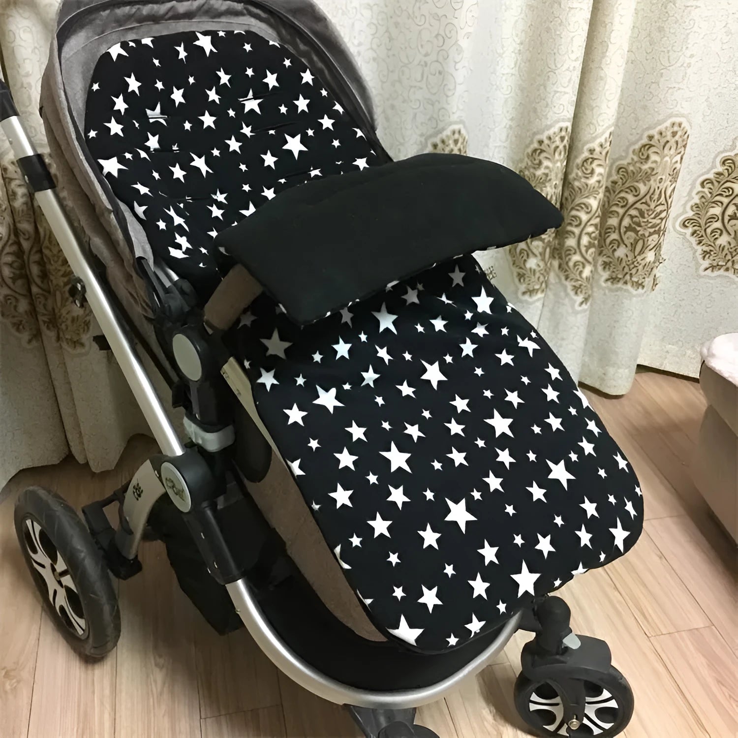Envelope-style baby stroller sleeping bag in a choice of colours with cotton wool filling.