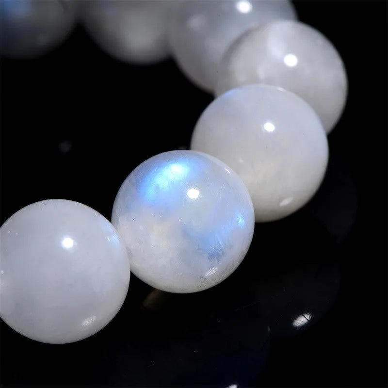 Natural moonstone round bead bracelet showing white blue moonlight colour