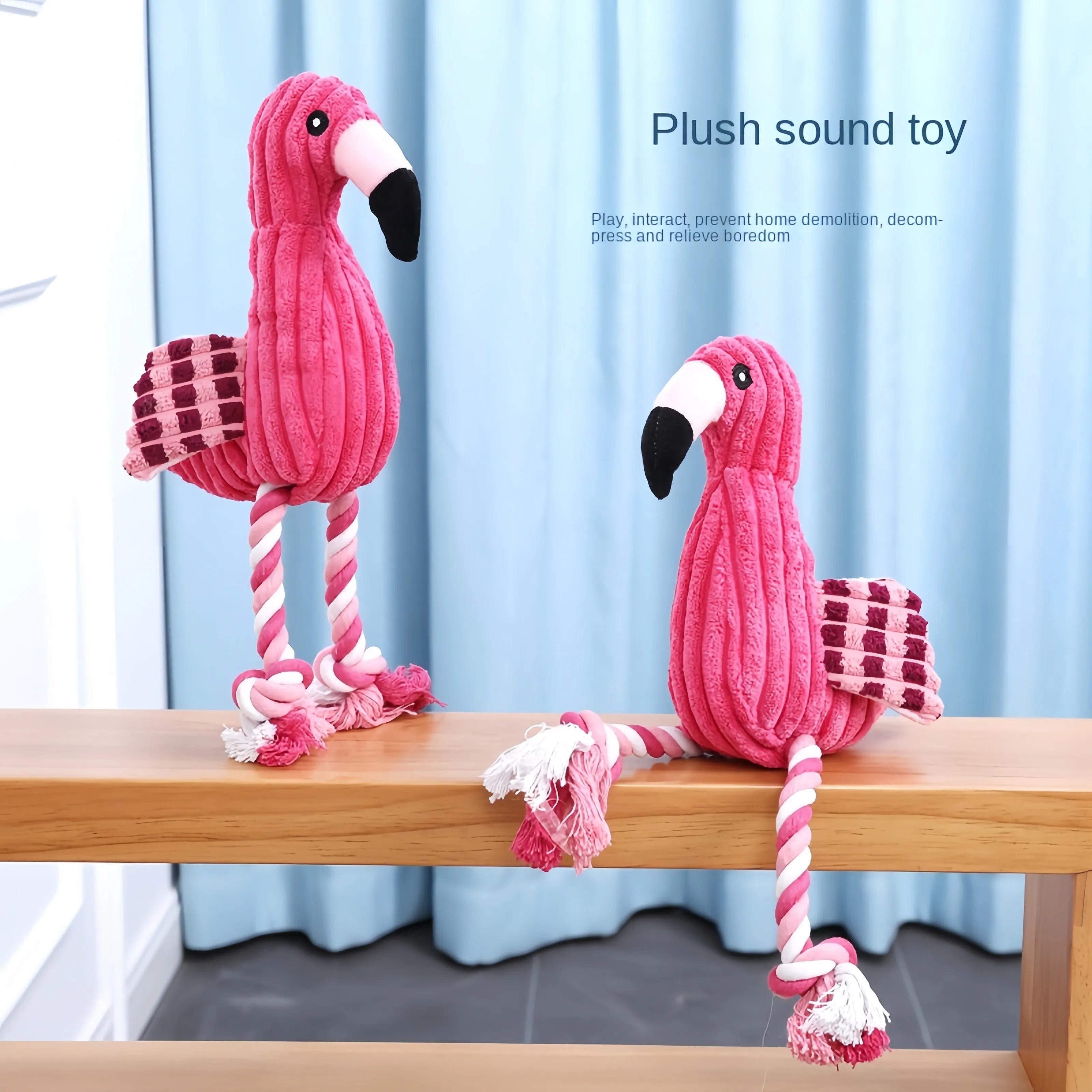 Pink animal-shaped corduroy plush dog toy with a squeaker.