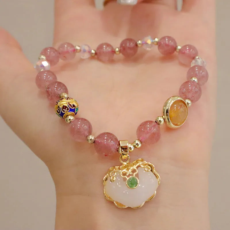 Geometric ethnic bracelet for women in choice of gray jade or strawberry quartz stone with metal decoration.