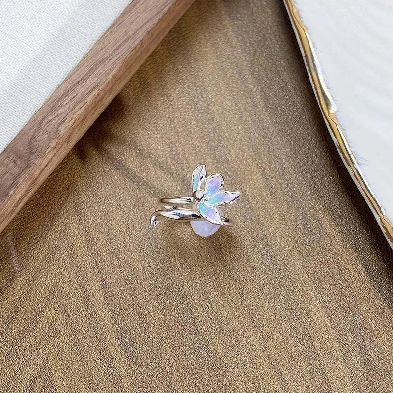 Adjustable copper fashion ring with modelled insect motif and metallic oil-finished surface.