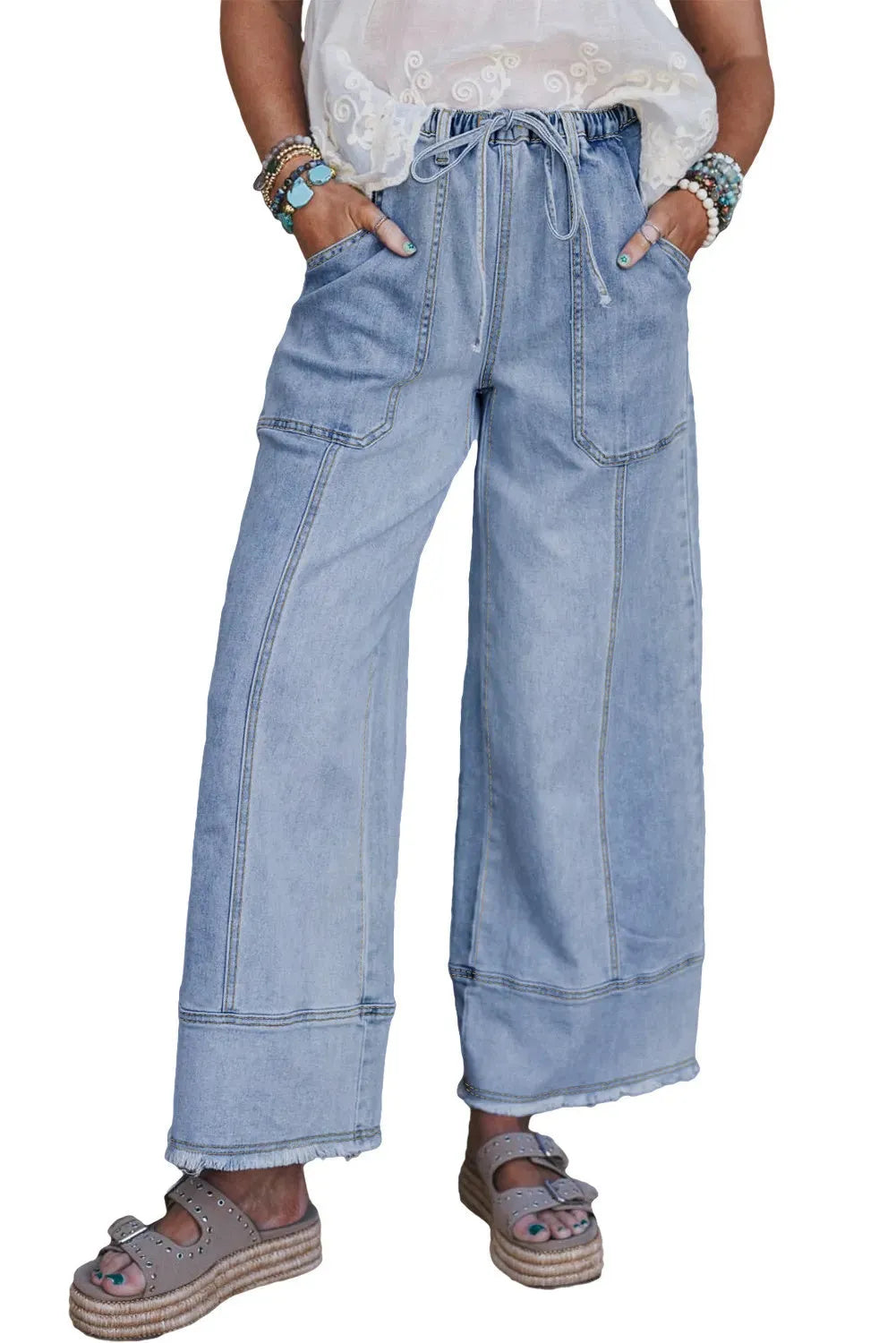 Beau Blue women's wide leg denim trousers featuring a drawstring waistband and raw hem detailing.