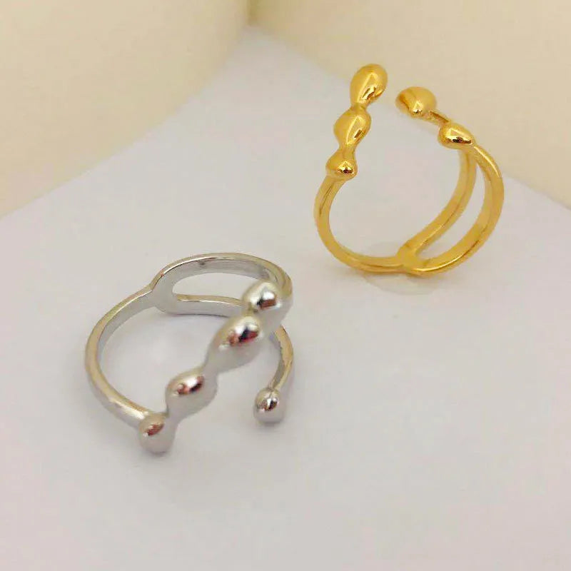 Adjustable open ring for women in brass with circular sphere design, gold or silver finish