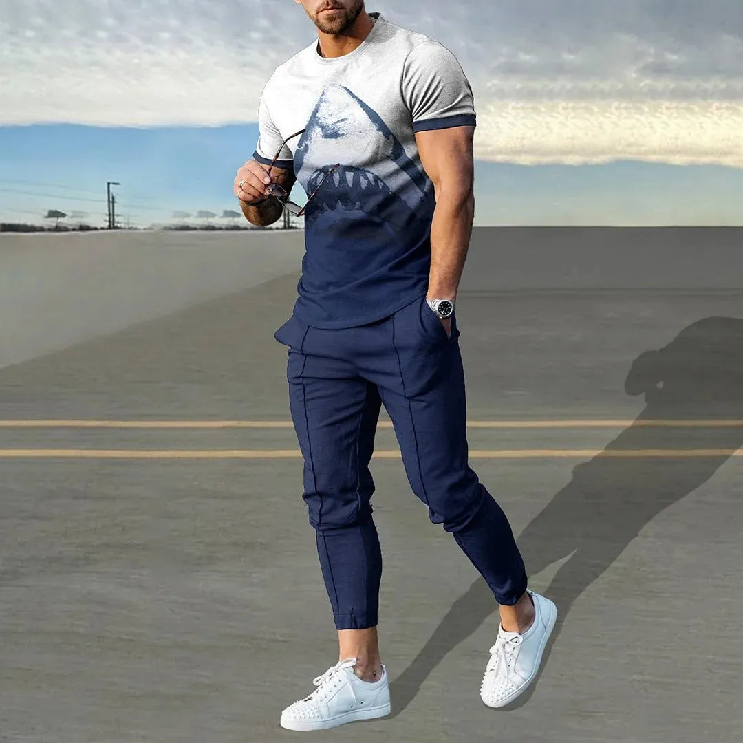 Men's short sleeve round neck T-shirt and matching trousers set in a light grey colour.