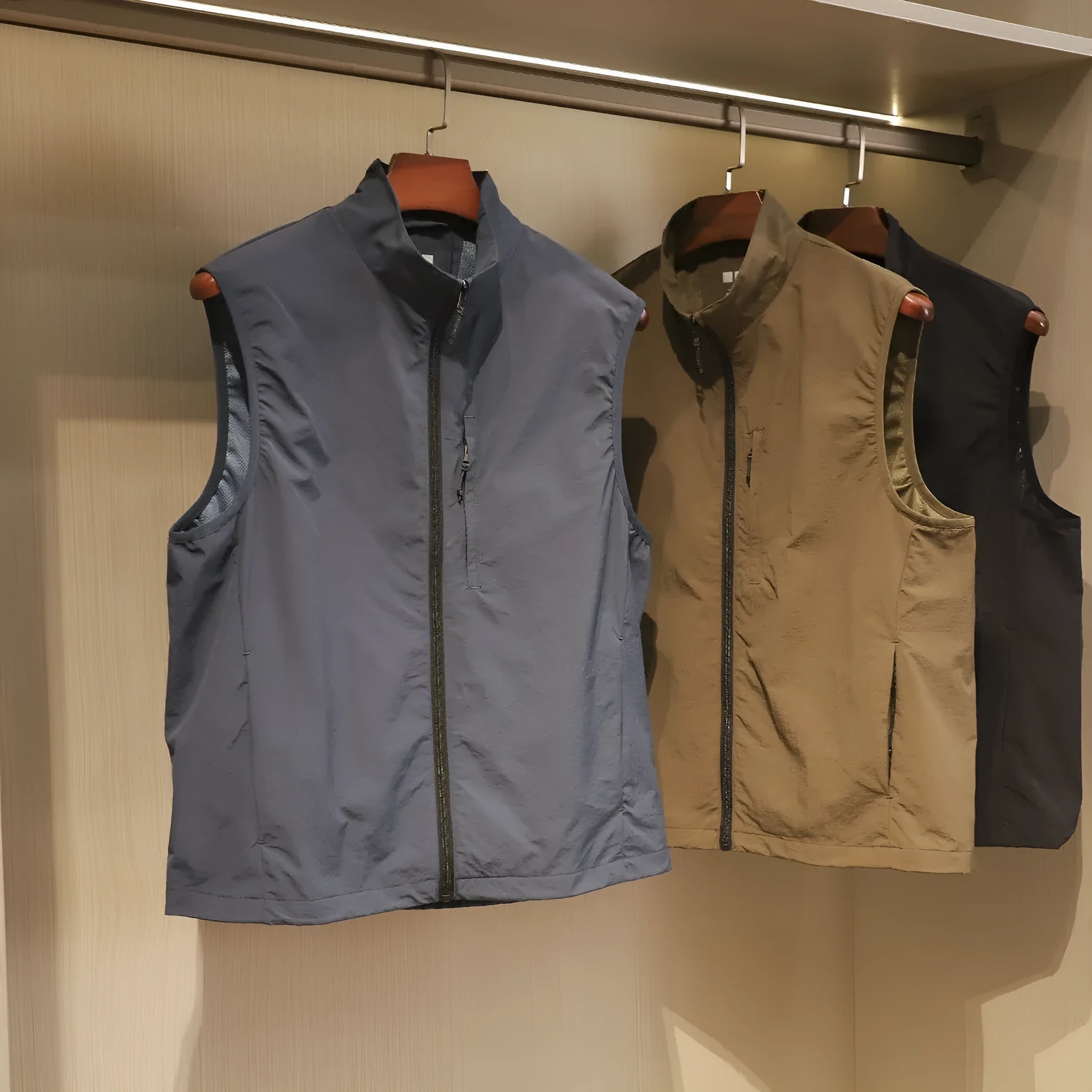 Men's thin nylon vest in Army Green, showing cardigan style and side seam pocket.
