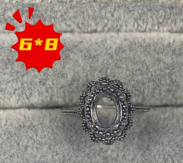 Oval denier open mouth ring with 6x8mm stone and five-pointed star on copper band.