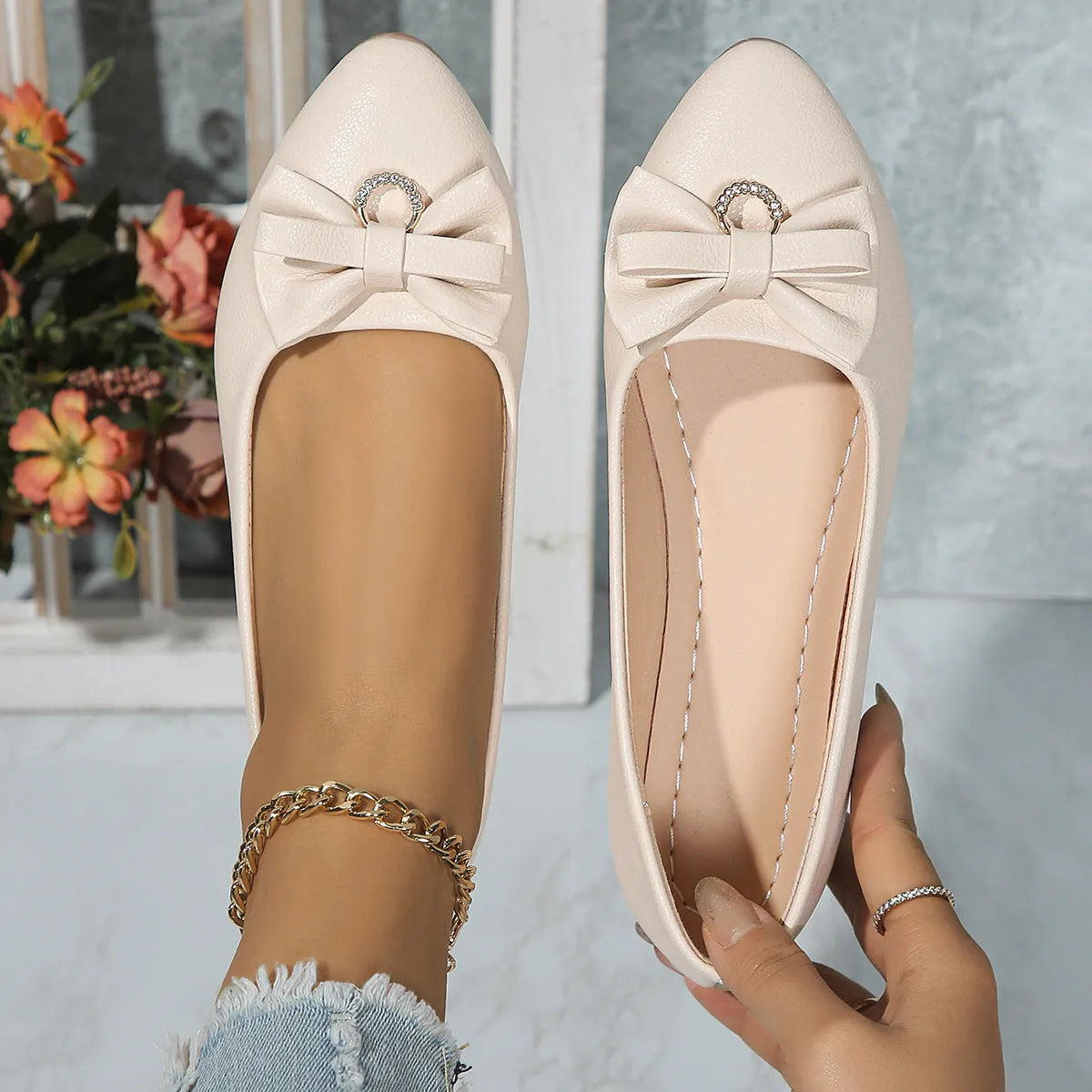 Women's beige casual flat shoes with a bowknot and round toe, showing the shallow mouth design.