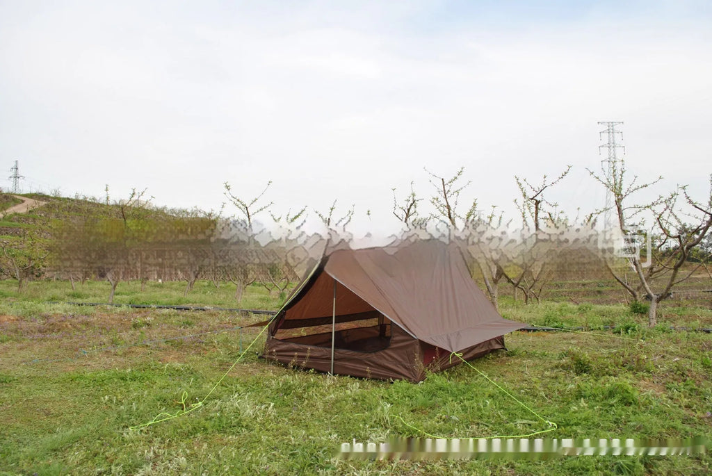 Brown or white A-line pole-free cabin tent for hiking, shown packed and pitched.
