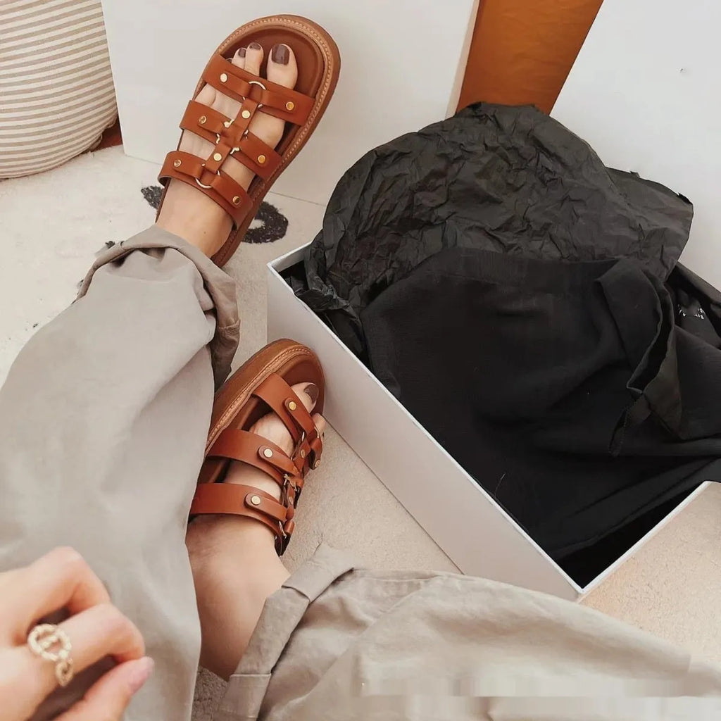 Women's Roman sandal slippers in genuine sheepskin leather available in black, brown, and white colours