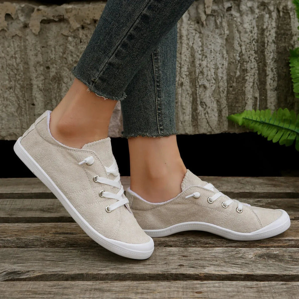 Women's creamy white fabric low-top casual sneakers with rubber sole