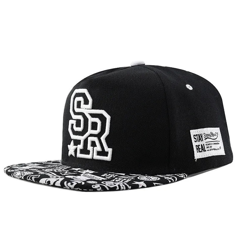 Cotton baseball cap with embroidered lettering in black or white with adjustable strap