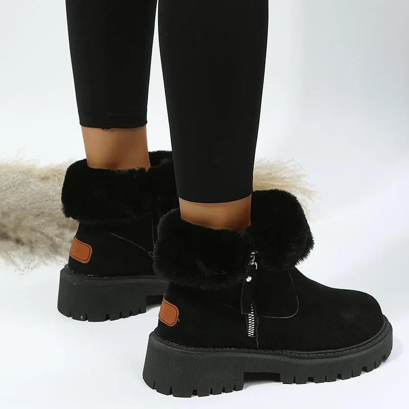 Women's black faux suede high-top snow boots with side zipper and thick plush lining.