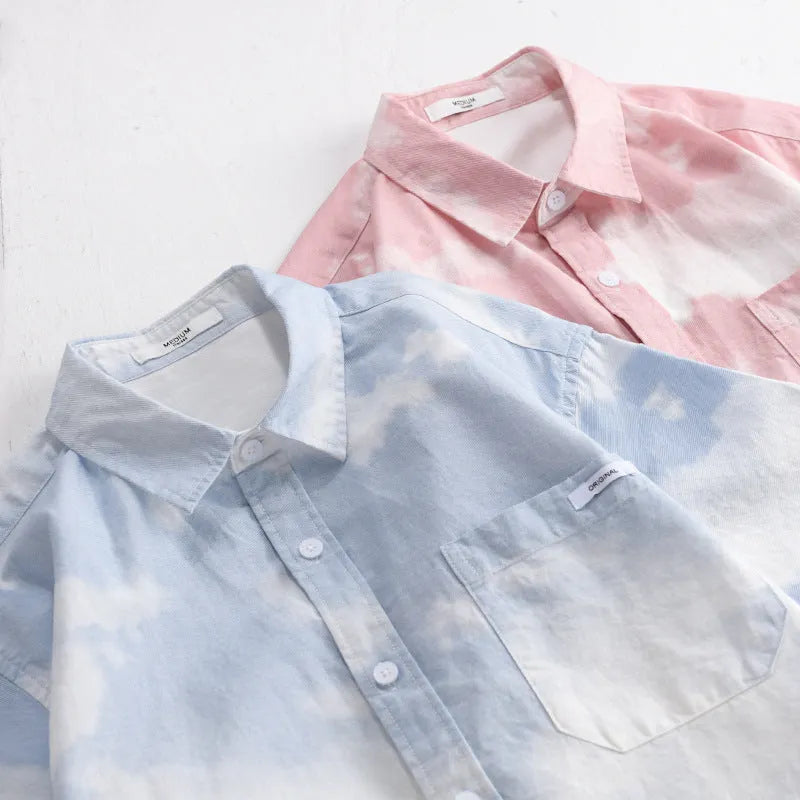 Man wearing a light pink loose-fit short-sleeved cotton shirt, casual summer style