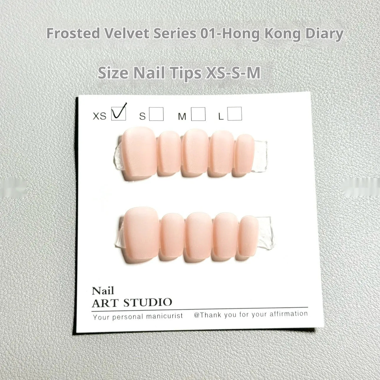 Set of frosted velvet Cat's Eye aurora effect artificial nails in short ladder sizes XS, S, and M.