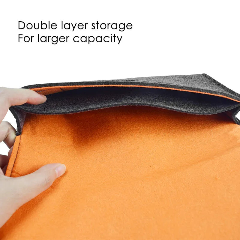 Black felt Nintendo Switch pouch case open to show console compartment and game card slots