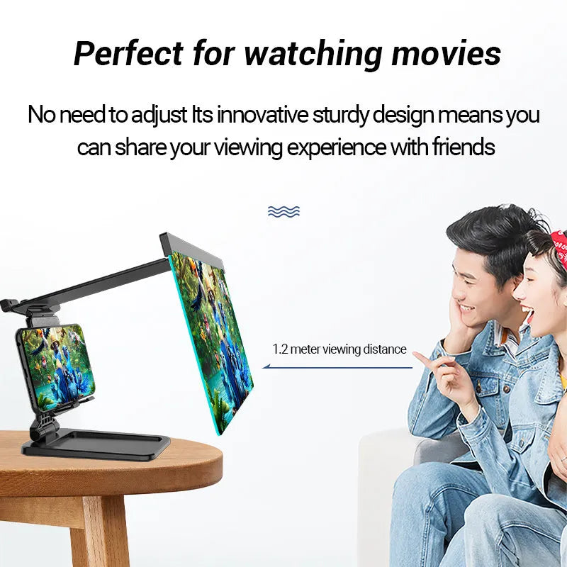 Black folding mobile phone screen magnifier with detachable holder on a desktop.