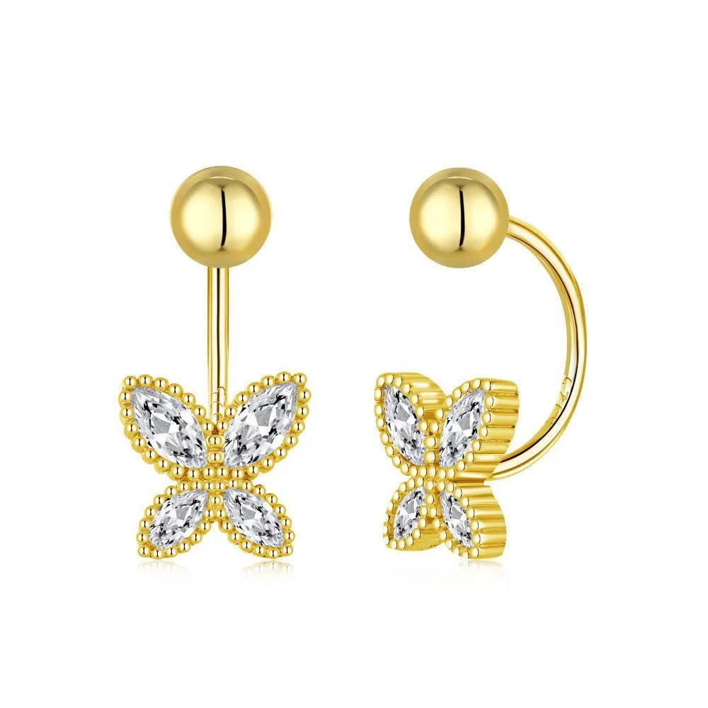 Pair of S925 silver bow-shaped ear hook earrings in gold finish on simple background