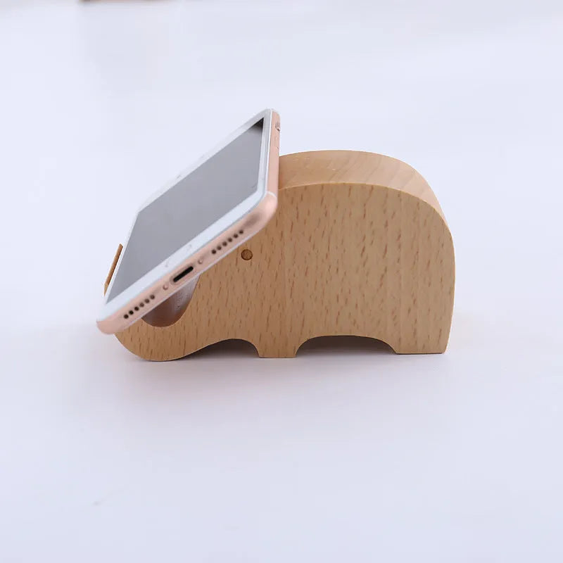 Decorative resin mobile phone stand in a choice of styles including animal figures and wood-effect designs.