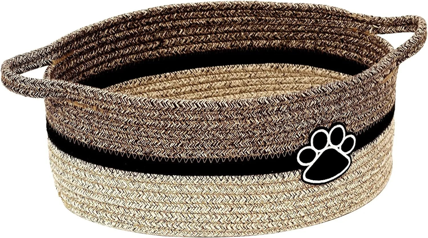 Light beige handmade cotton rope storage basket with a handle on a wooden floor.