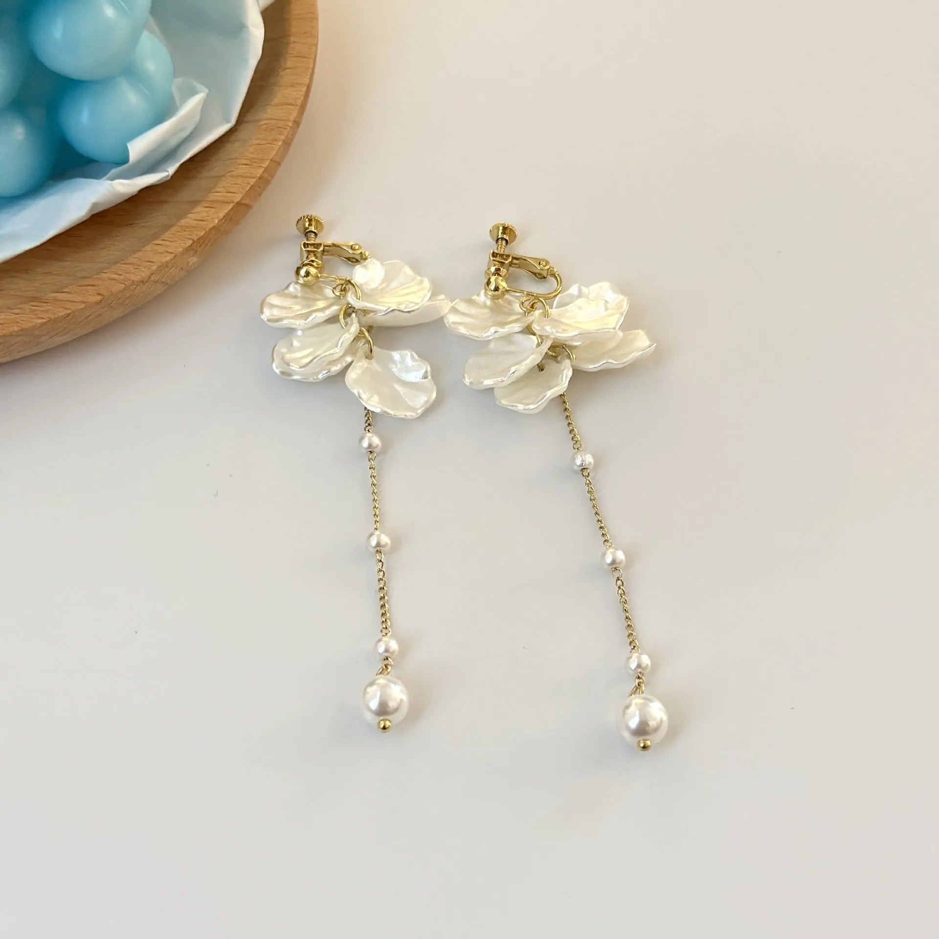 Women's shell acrylic pearl tassel earrings showing 8.8cm length with four clip style options