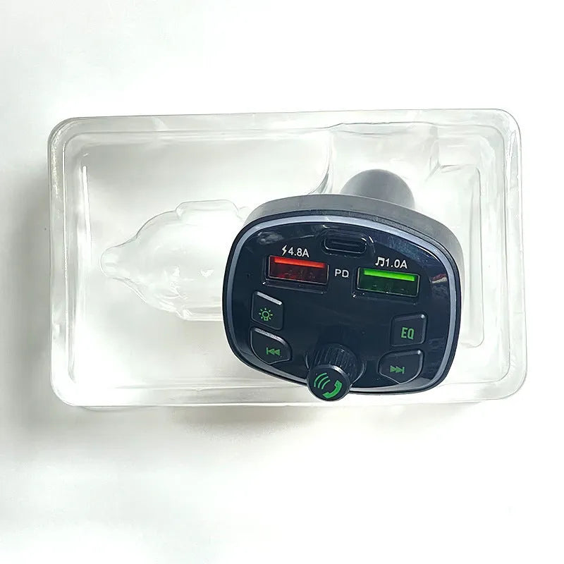 Q7 Automotive MP3 Player Bluetooth FM Transmitter connected to car cigarette lighter socket, showing 1.1-inch display.