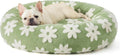 Round plastic dog bed with plaid fabric cover in blue and white pattern