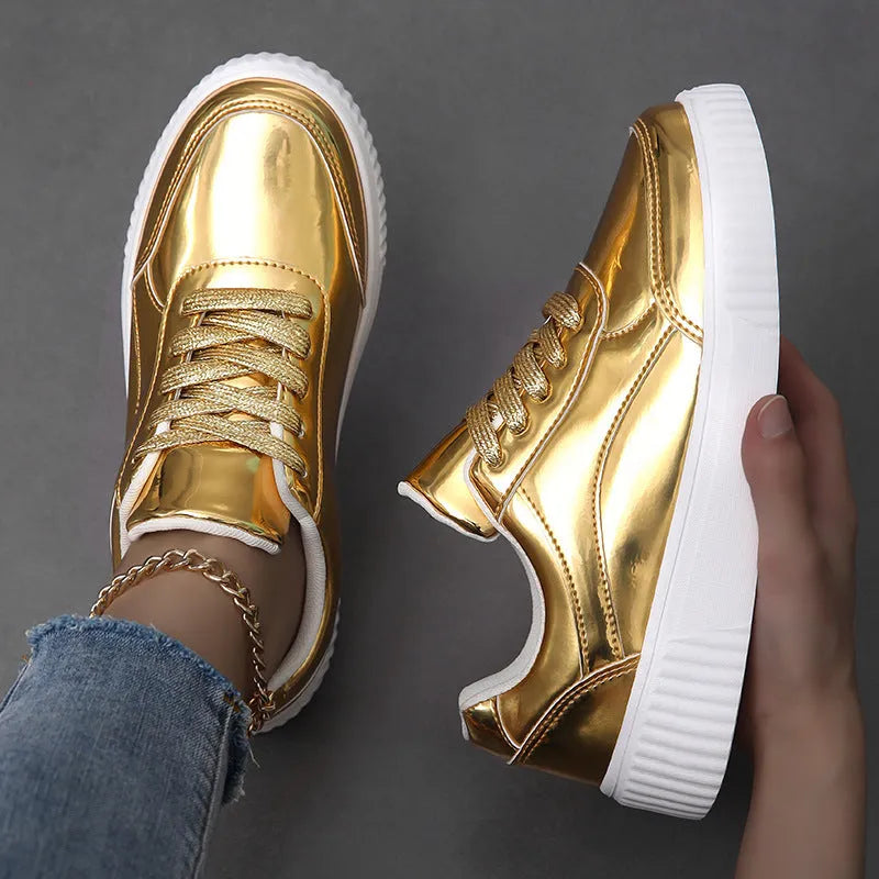 Gold sequinned platform sneakers with a round toe and a thick MD sole.