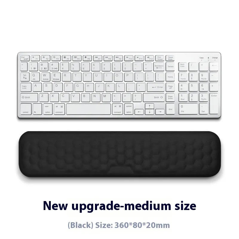 Grey and black memory foam mouse wrist pads with silicone bases, shown in cloth and leather cover options.