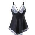 Plus size women's two-piece bikini swimsuit in dark blue, showing backless design.