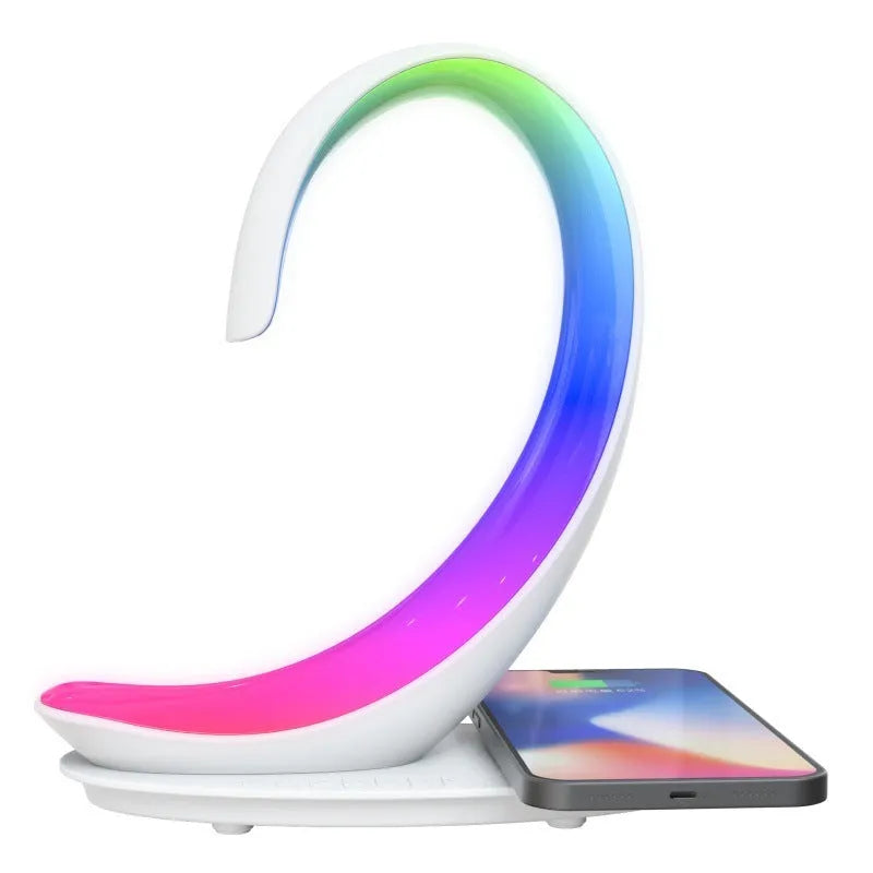 White swan-shaped desktop wireless charger with Bluetooth speaker and colourful LED atmosphere lighting