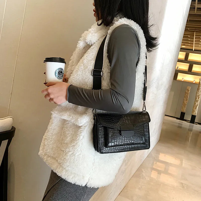Vintage-style black PU leather crossbody bag with adjustable strap