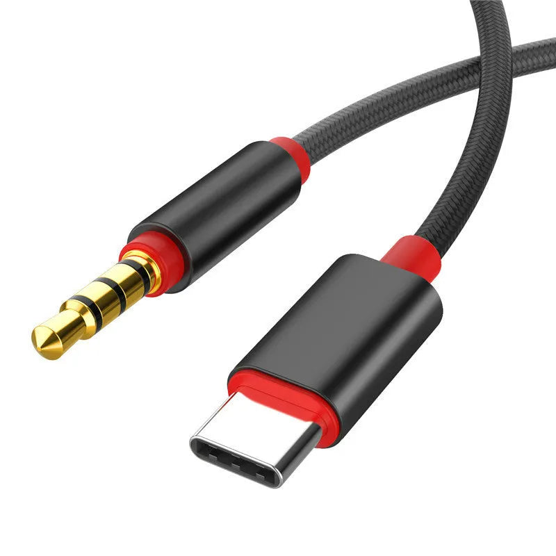 Black nylon braided audio cable with 3.5mm connectors next to silver version.