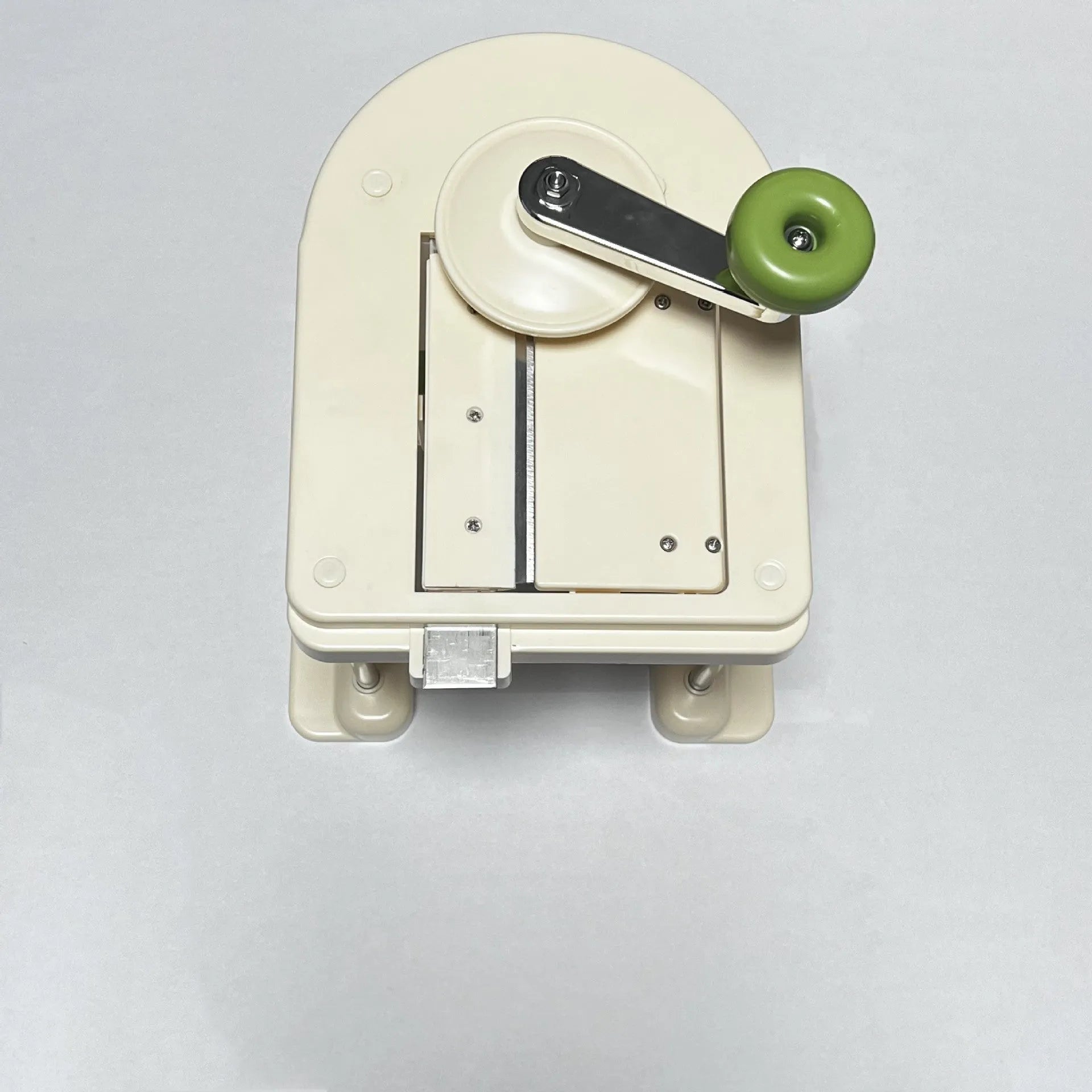 Beige multifunctional stainless steel vegetable slicer, chopper, and grater kitchen tool.
