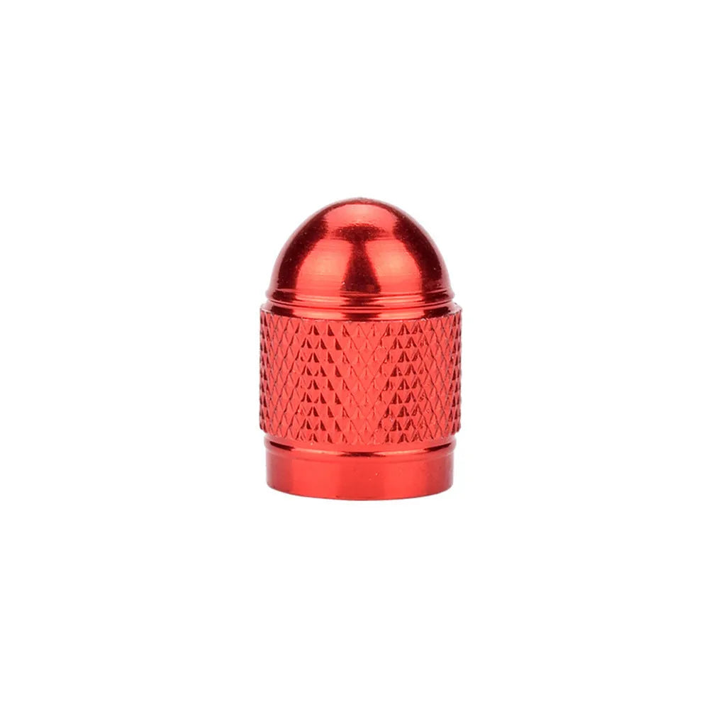Aluminium mountain bike tyre valve dust cap in gold, red, silver, blue, and black colours.