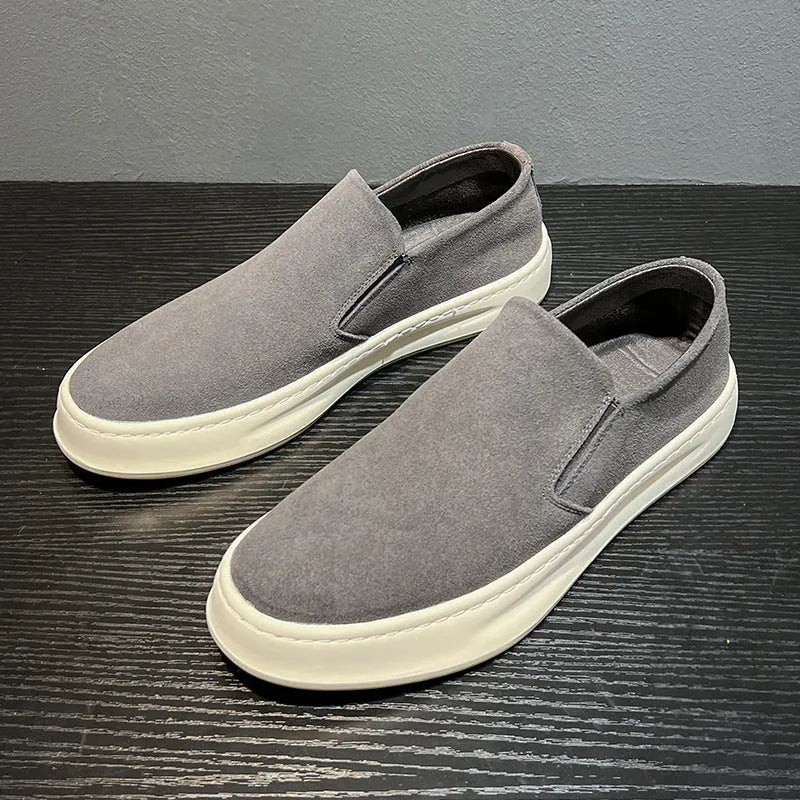 Men's grey casual shoes with round toe and sewing line detail on PU upper