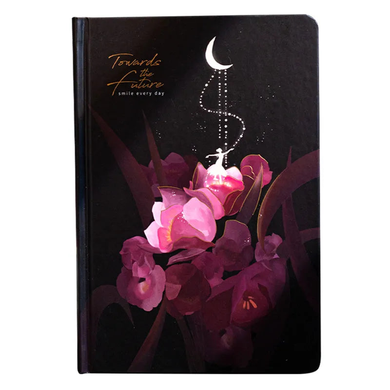 A5 scrapbook notebook with luminous cover open to show colour illustration pages, in purple colour option.