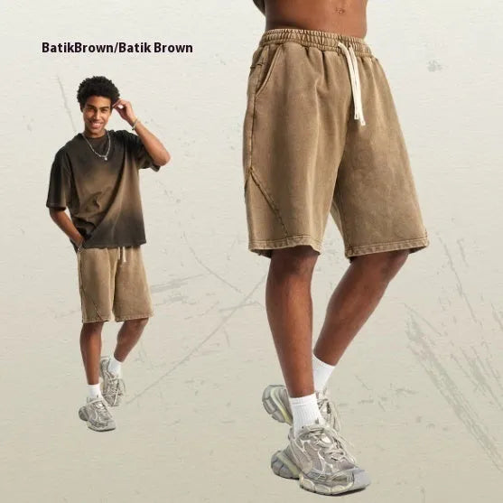 Men's batik washed cotton terry shorts in loose fit, shown in Batik Black colour