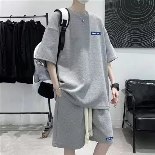 Cotton-blend waffle textured leisure sports suit with short sleeves and shorts.