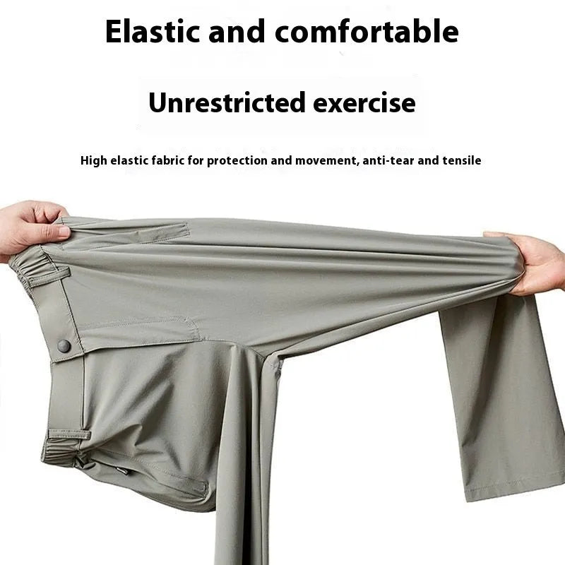 Man wearing black ice silk straight leg loose fit casual trousers with an elastic waistband