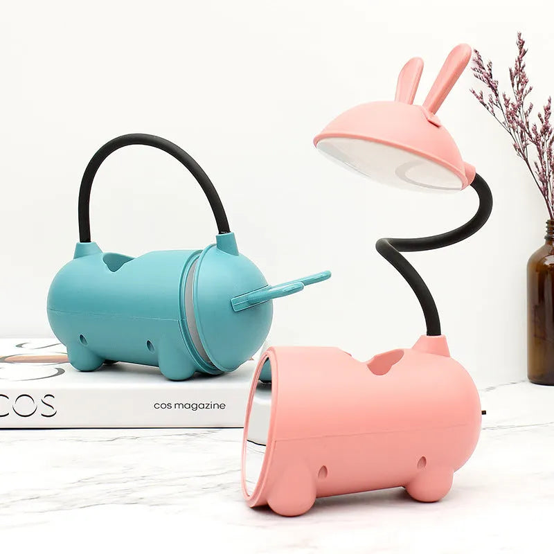 Cartoon-style USB desk lamp with pen container in green, dark blue or pink colour options