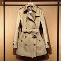 Khaki women's double-breasted trench coat with flight sleeves and shoulder detail