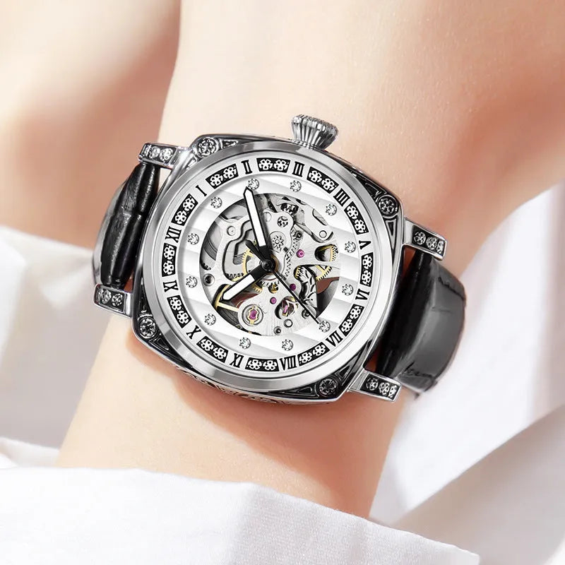Mechanical wristwatch with luminous hands on a leather strap, shown in multiple colour options.