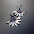 Purple resin Bohemian earrings with animal zodiac design on alloy metalwork.