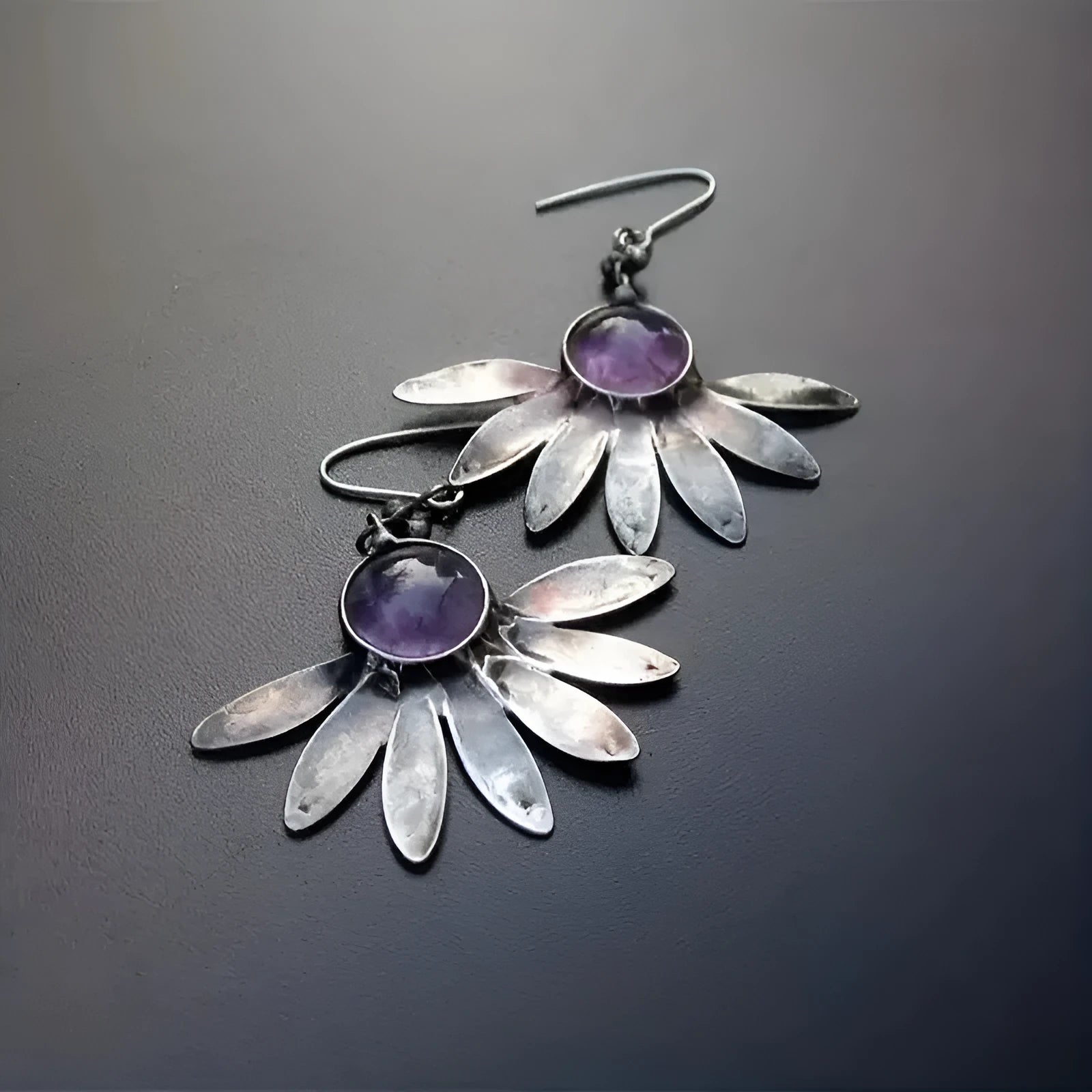 Purple resin Bohemian earrings with animal zodiac design on alloy metalwork.