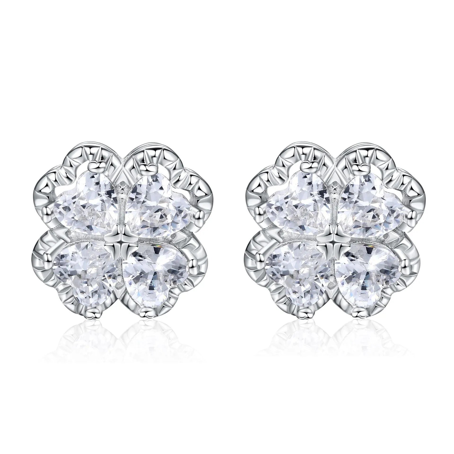 Pair of heart-shaped silver earrings with a four-leaf clover design and zircon stones.