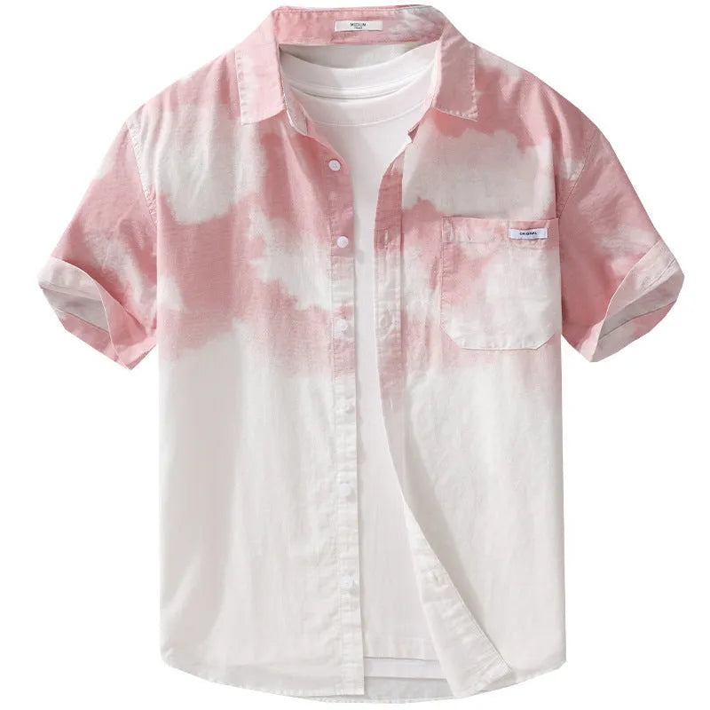 Man wearing a light pink loose-fit short-sleeved cotton shirt, casual summer style
