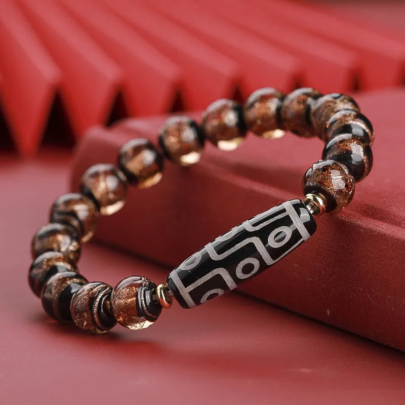 Chinese-style coloured glaze lucky bead bracelet with auspicious patterns for the Year of the Snake.