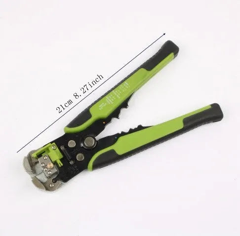 Yellow automatic 3-in-1 wire stripper, crimper, and cutter tool on a workbench.