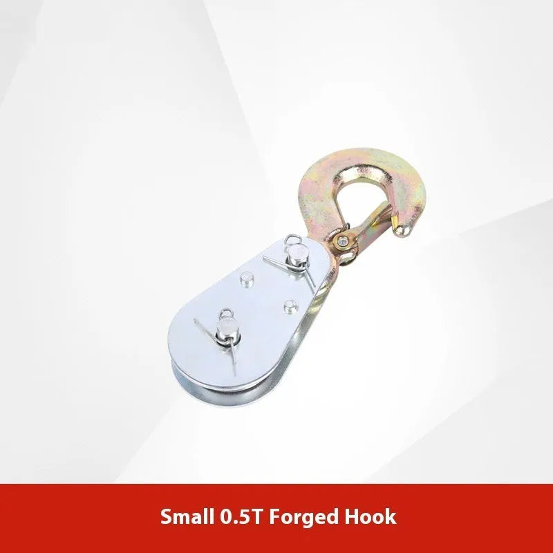 Red industrial steel lifting pulley with a safety latch on the hook.