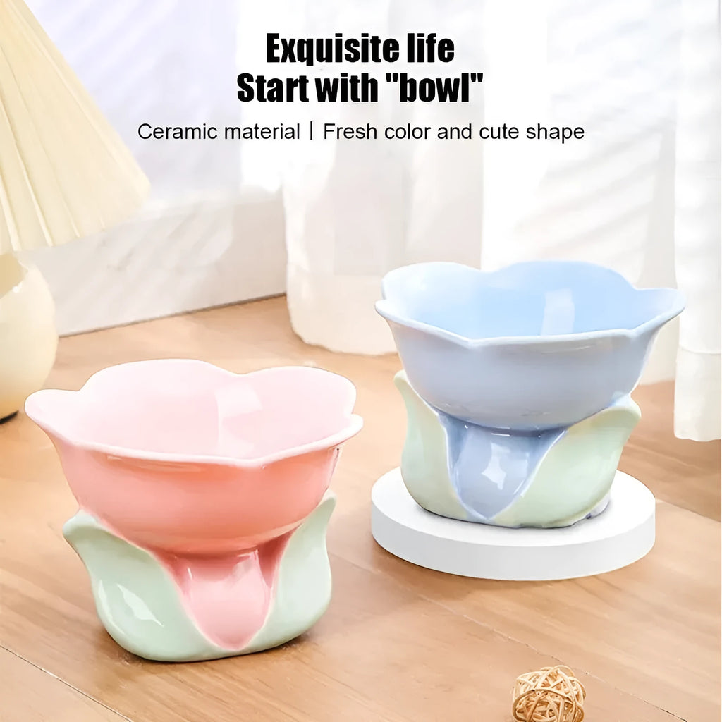 Pink floral patterned raised ceramic bowl for cat or small dog feeding on a non-slip base.